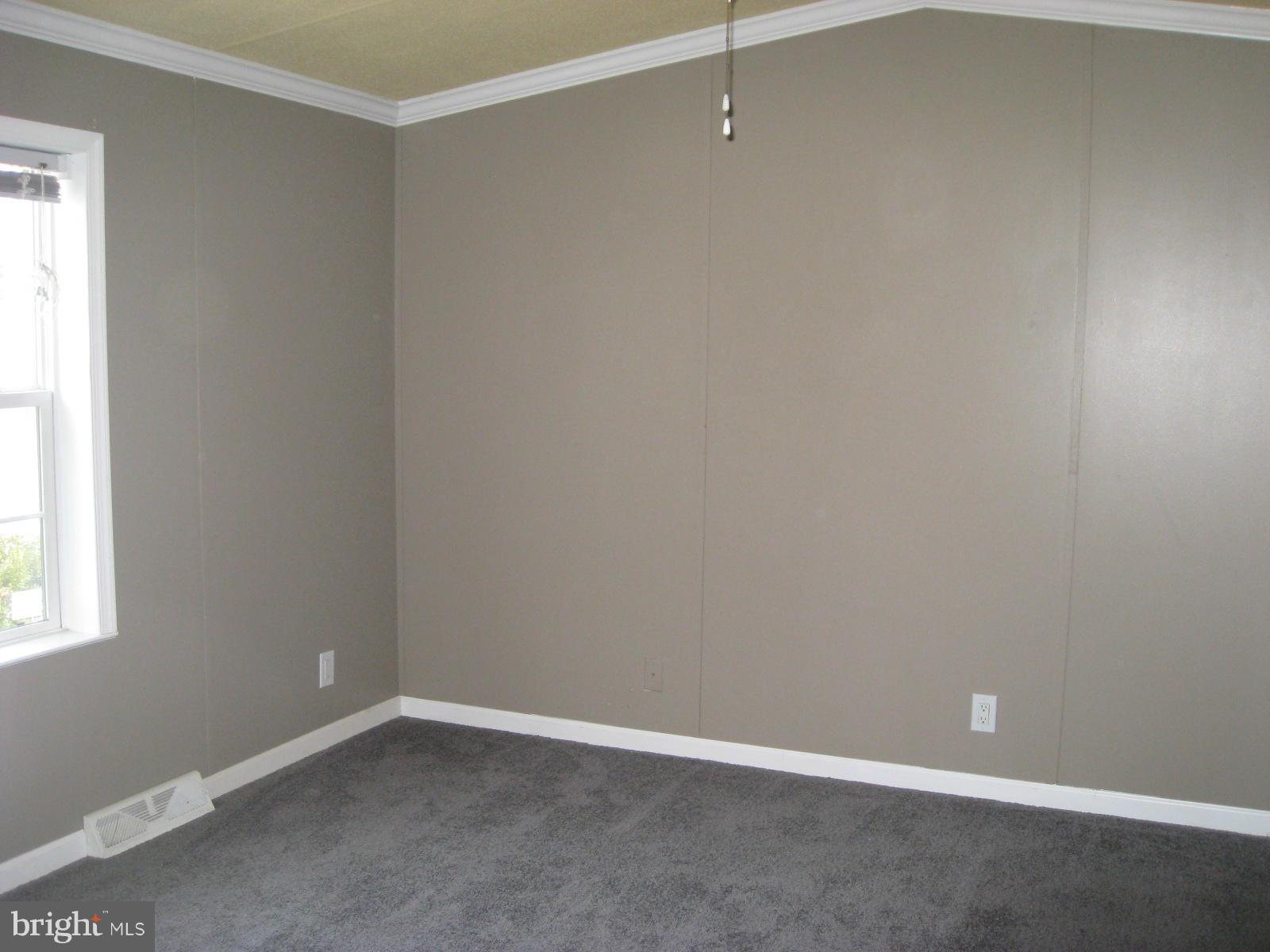 18109 Three Notch Road Lexington Park, MD 20653 - Photo 5 of 6 an empty room with a window