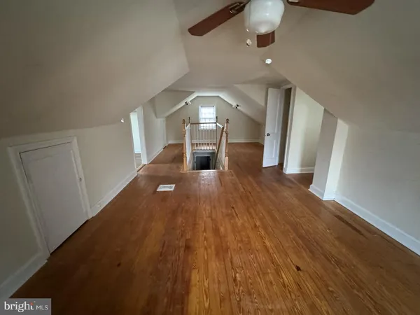a view of a living room with wooden floor