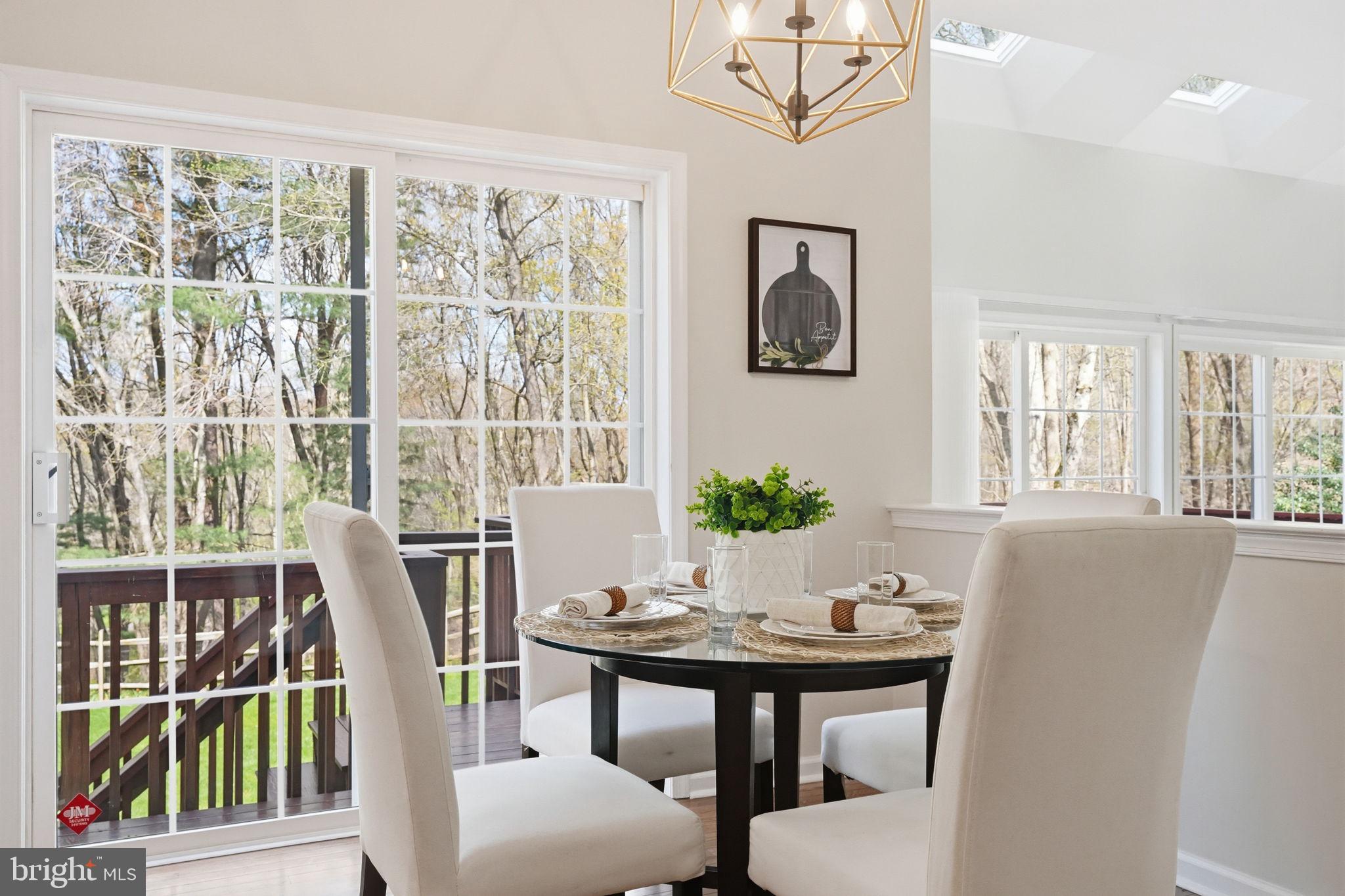520 Sunset Hollow Road West Chester, PA 19380 - Photo 24 of 68 a view of a dining room with furniture window and wooden floor