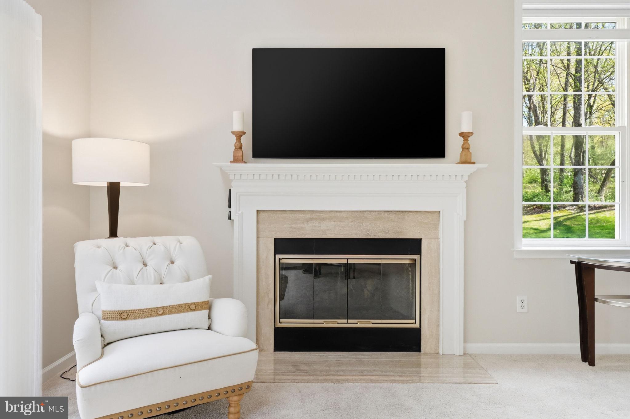520 Sunset Hollow Road West Chester, PA 19380 - Photo 27 of 68 a living room with furniture a fireplace and a flat screen tv
