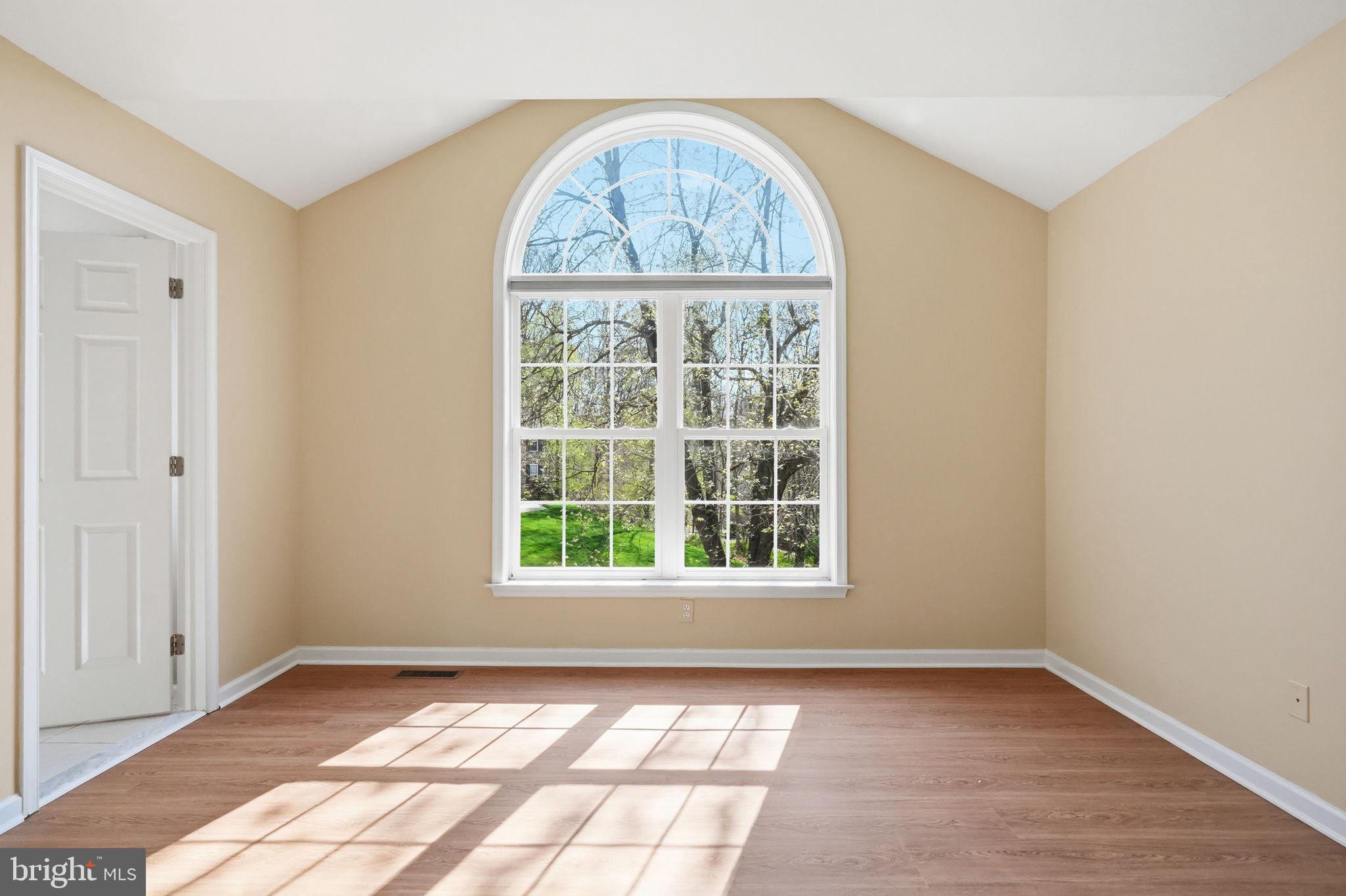 520 Sunset Hollow Road West Chester, PA 19380 - Photo 49 of 68 an empty room with wooden floor and windows