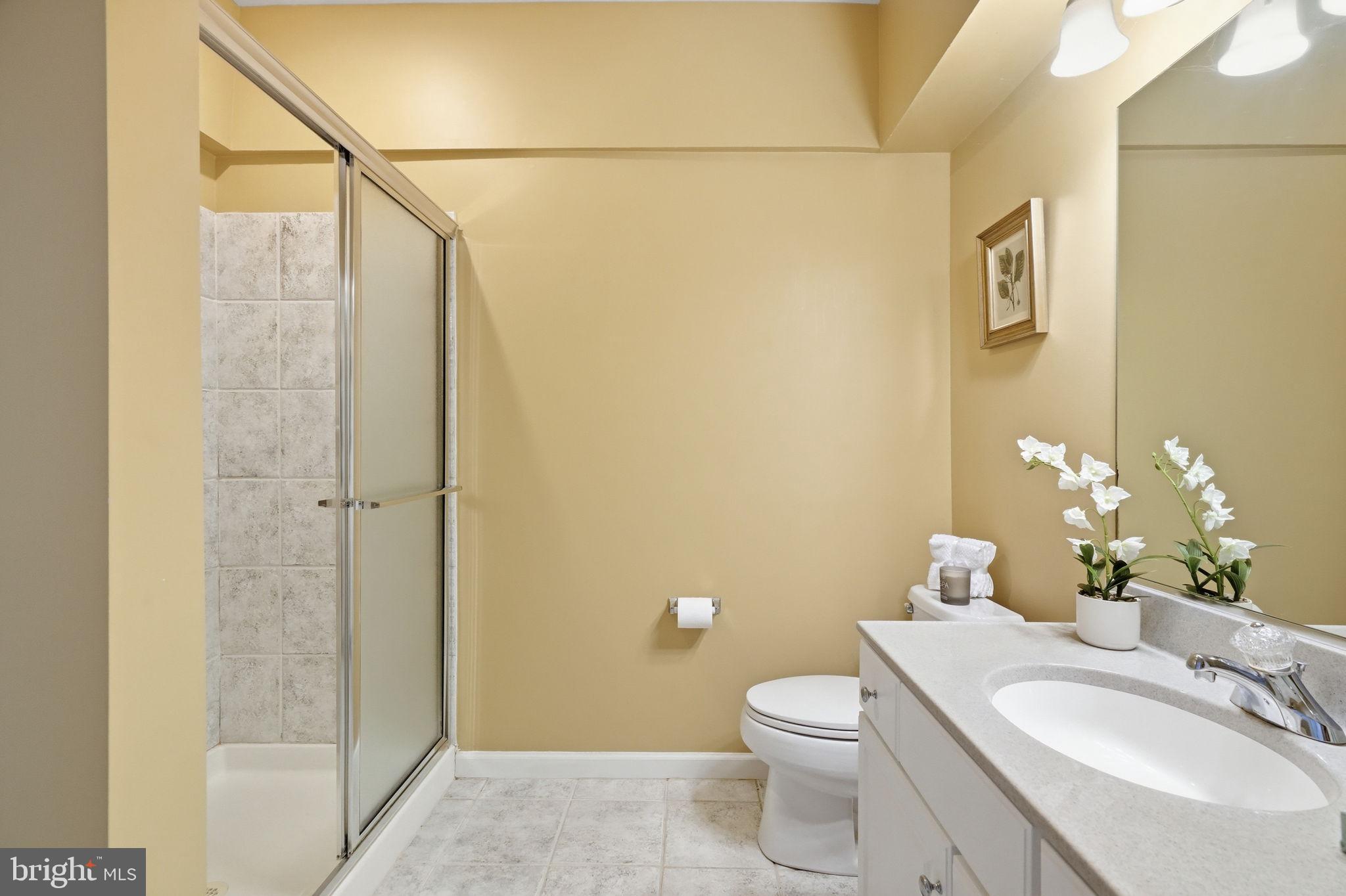 520 Sunset Hollow Road West Chester, PA 19380 - Photo 57 of 68 a bathroom with a granite countertop sink toilet and shower