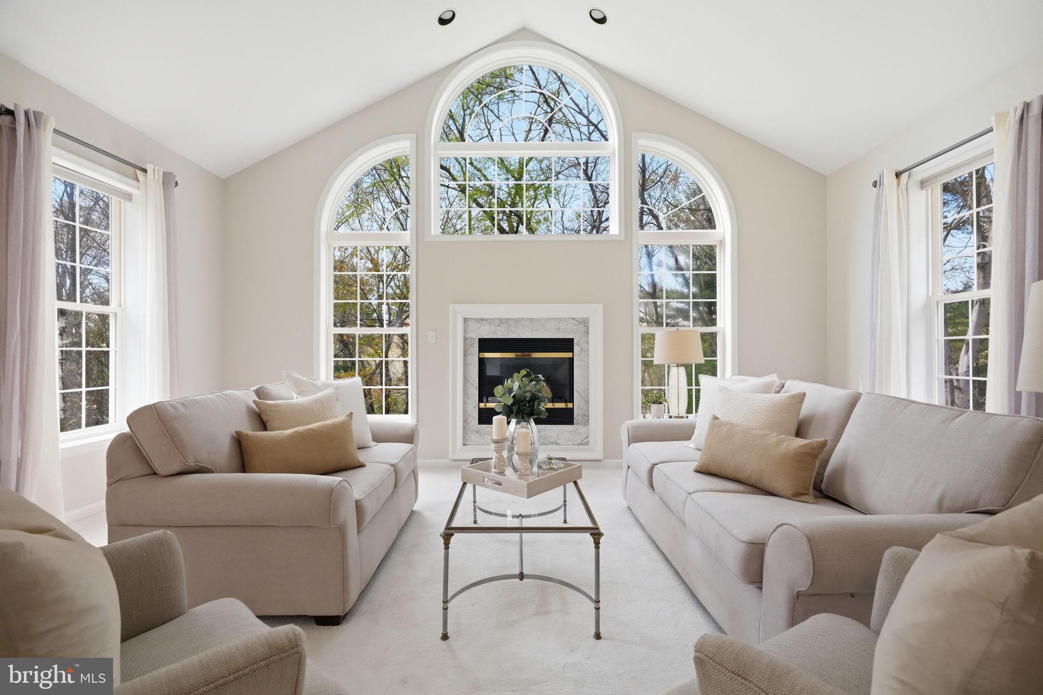 520 Sunset Hollow Road West Chester, PA 19380 - Photo 8 of 68 a living room with furniture a fireplace and a large window