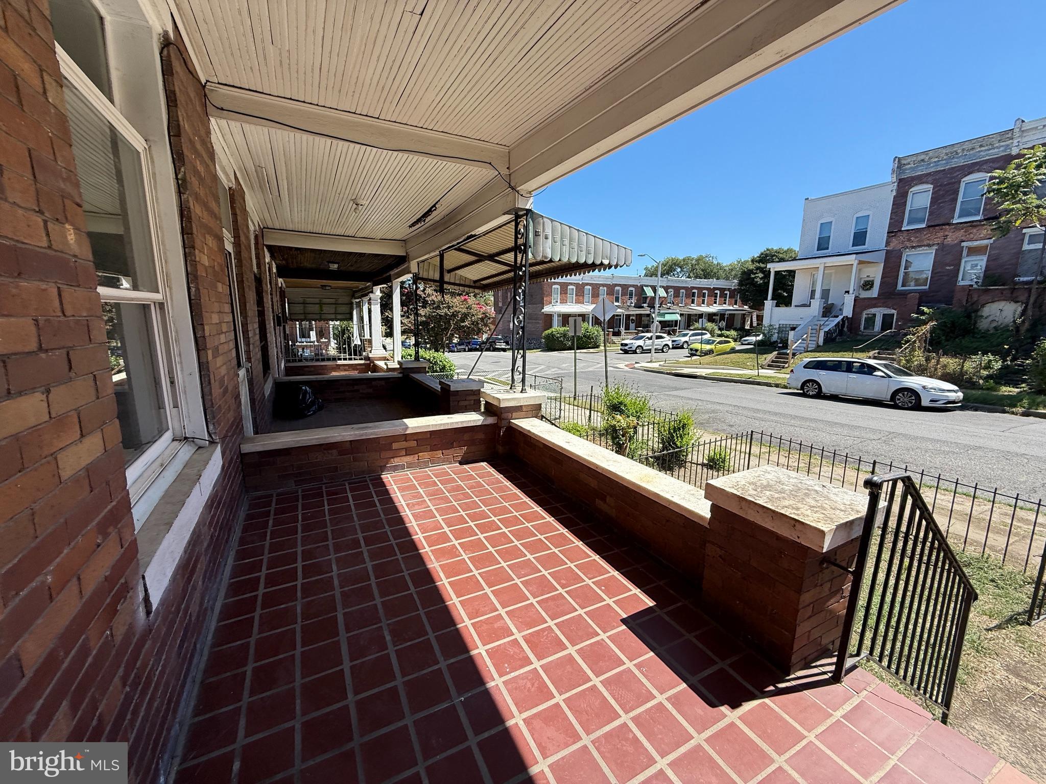 2706 Winchester Street Baltimore, MD 21216 - Photo 13 of 16 a view of a balcony with car parked