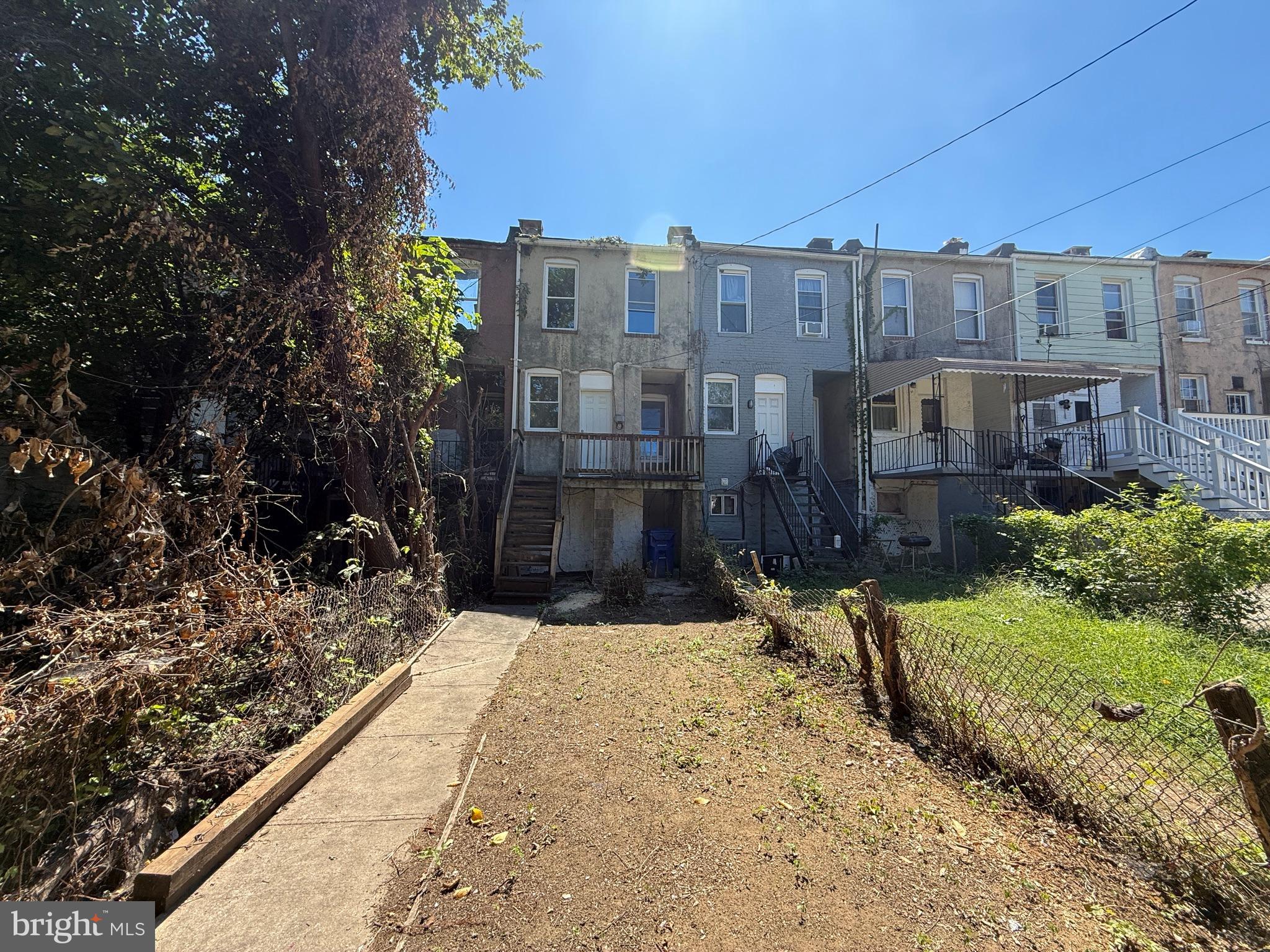 2706 Winchester Street Baltimore, MD 21216 - Photo 14 of 16 a view of a house with a yard