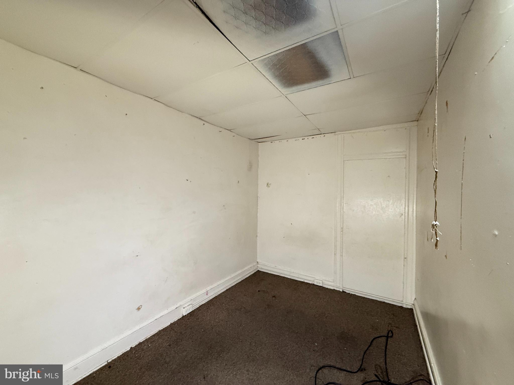 2706 Winchester Street Baltimore, MD 21216 - Photo 7 of 16 an empty room with a workbench