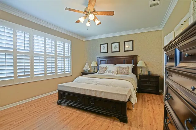 a living room with furniture and large windows
