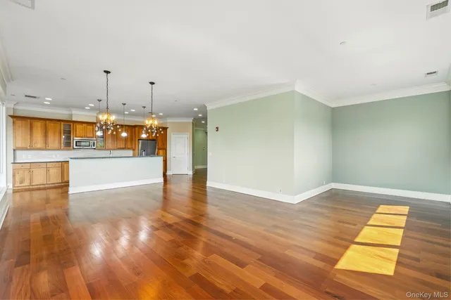 a view of a kitchen with a sink and a window