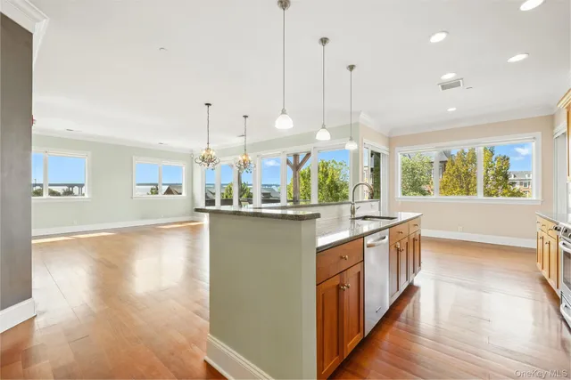 a view of an empty room with glass door and a window
