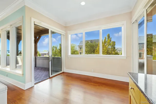 a view of an entryway with wooden floor