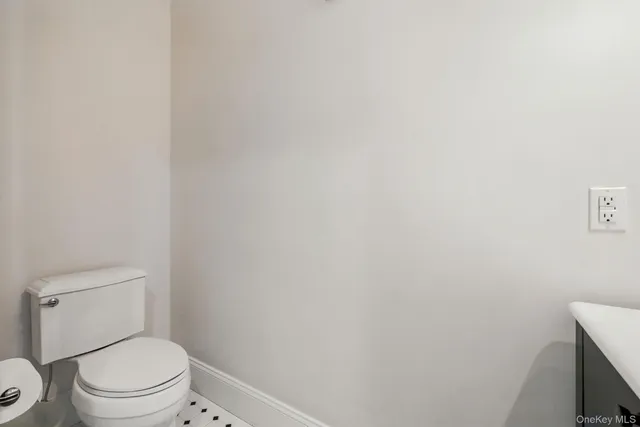 a living room with fireplace furniture and a potted plant