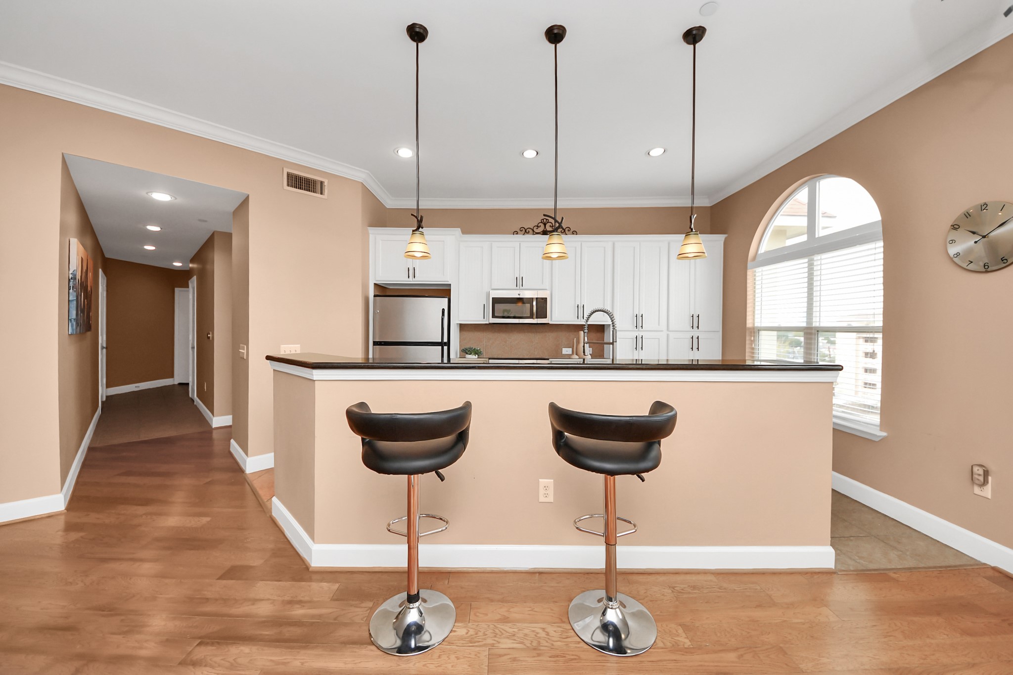 2203 Dorrington Street, Unit 400 Houston, TX 77030 - Photo 13 of 43 a kitchen with stainless steel appliances granite countertop a stove a sink a counter space and a chandelier