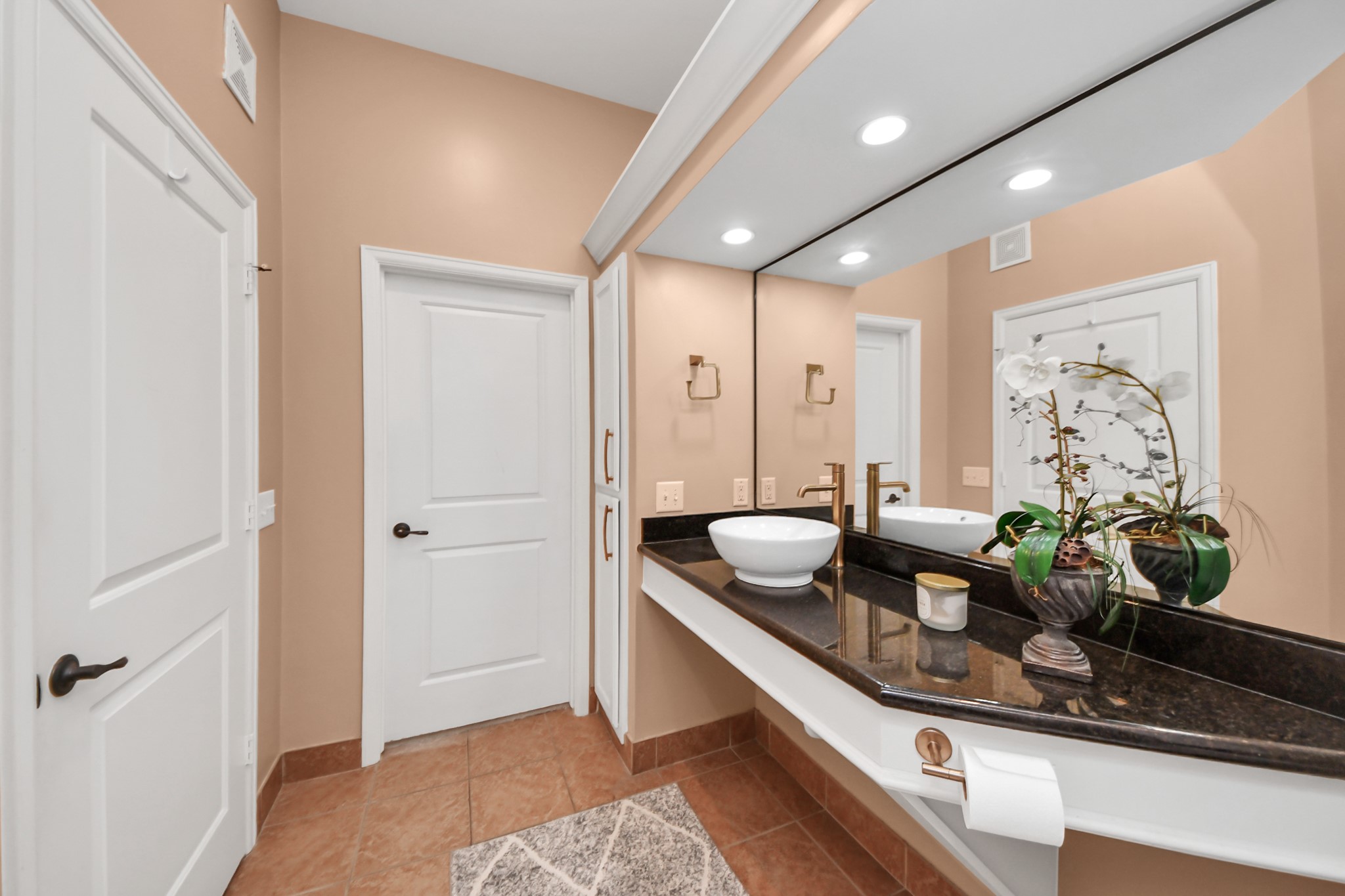 2203 Dorrington Street, Unit 400 Houston, TX 77030 - Photo 25 of 43 a view of kitchen island with stainless steel appliances granite countertop sink and living room