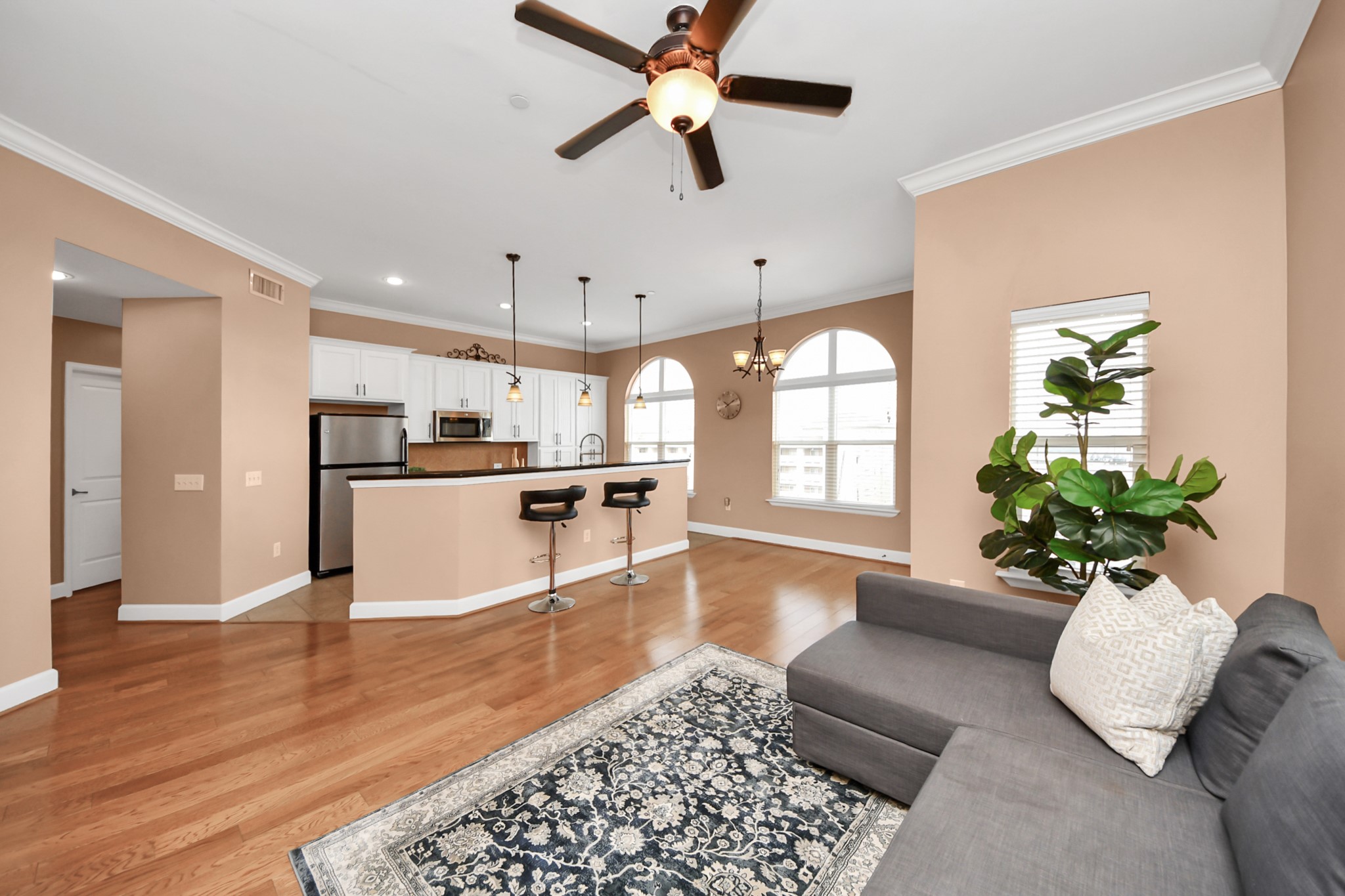 2203 Dorrington Street, Unit 400 Houston, TX 77030 - Photo 7 of 43 a living room with furniture kitchen and a chandelier