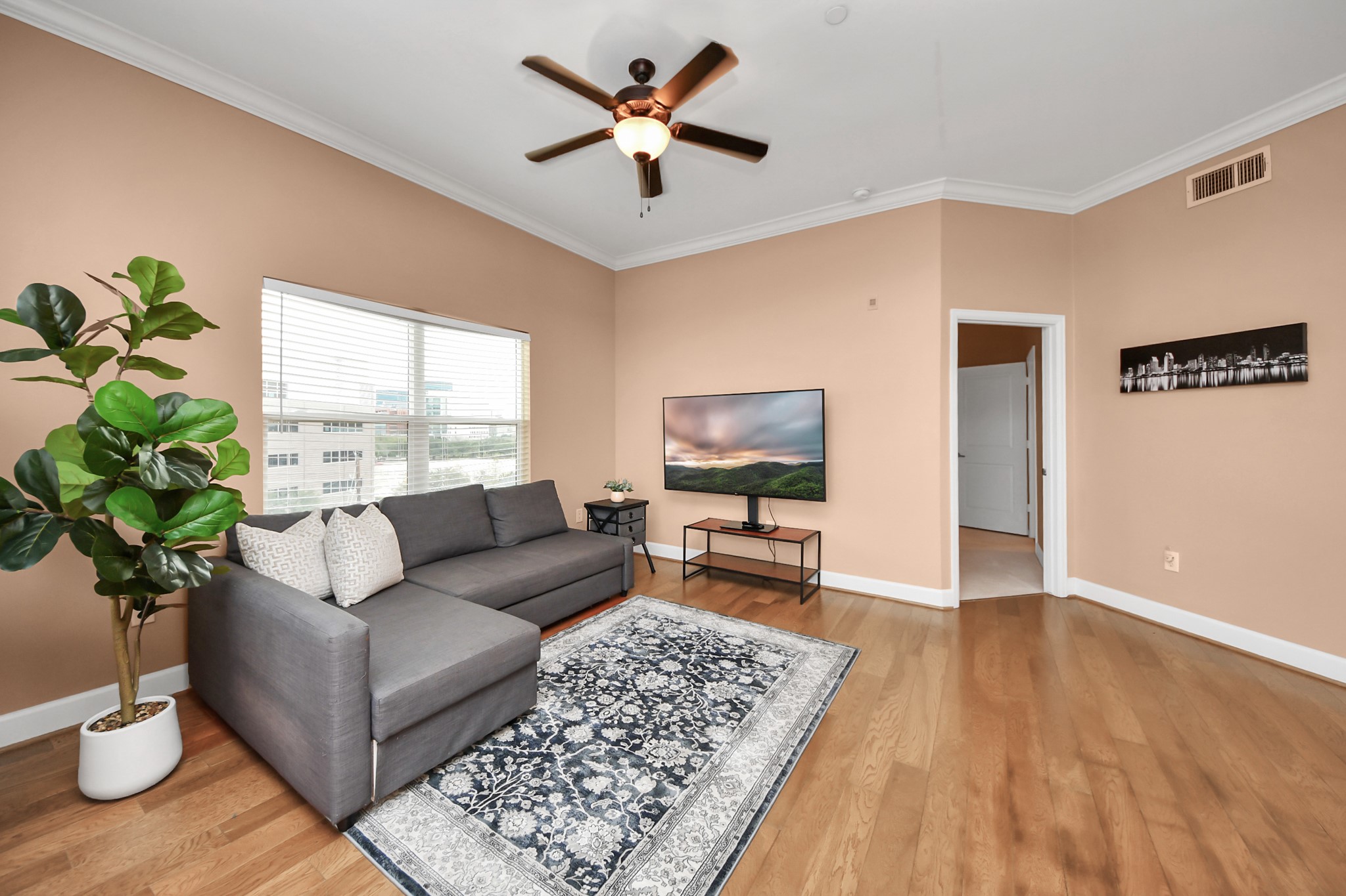 2203 Dorrington Street, Unit 400 Houston, TX 77030 - Photo 9 of 43 a living room with furniture and a potted plant
