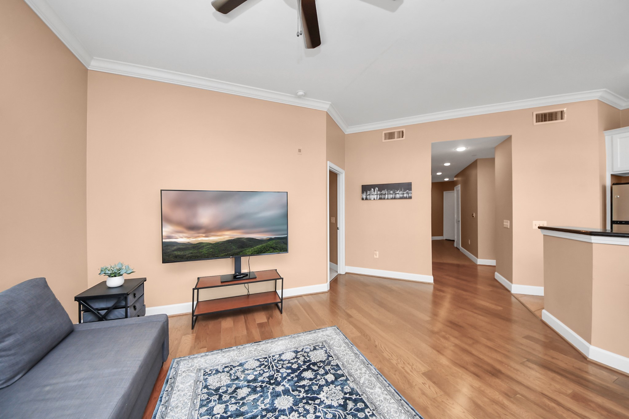 2203 Dorrington Street, Unit 400 Houston, TX 77030 - Photo 10 of 43 a living room with furniture and a flat screen tv