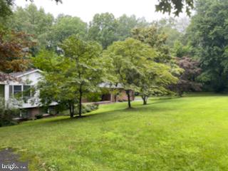 6520 Wilson Road Friendship, MD 20758 - Photo 2 of 3 a view of a field of grass and trees