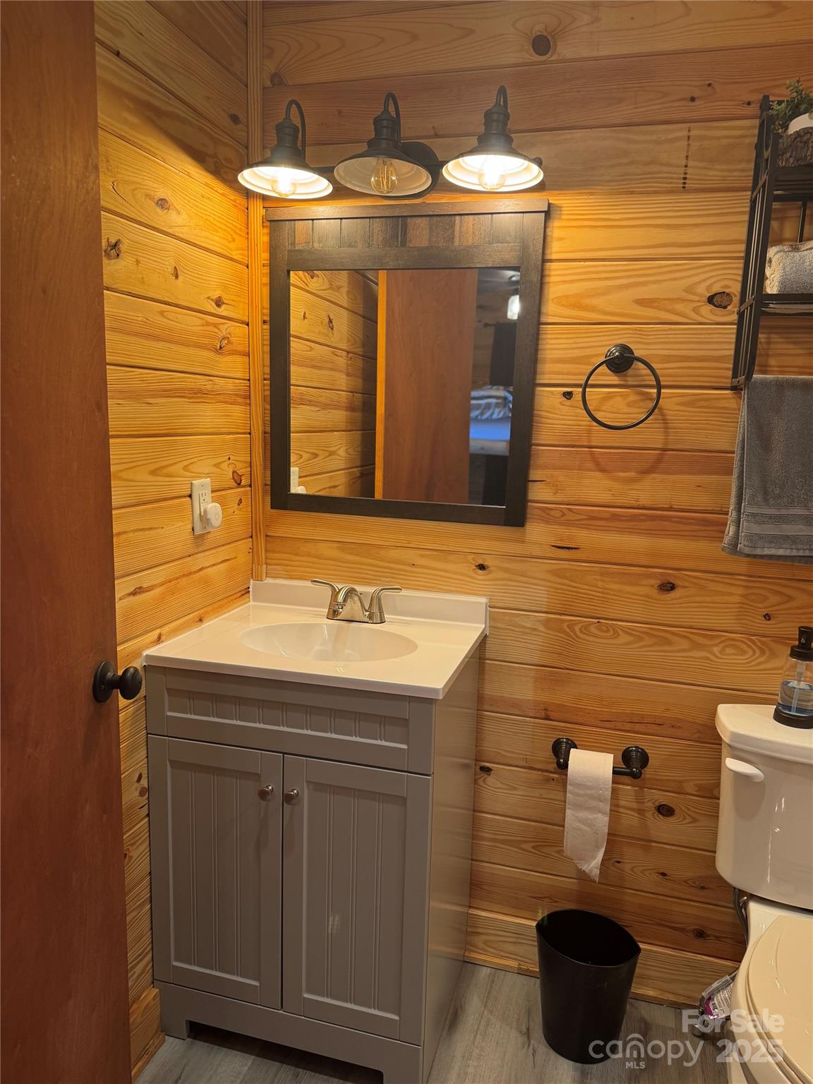 7042 Martin Lane Morganton, NC 28655 - Photo 24 of 26 a bathroom with a toilet a sink and mirror
