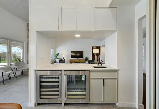 a kitchen with cabinets and a stove