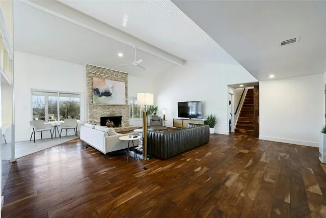 a living room with furniture and a fireplace