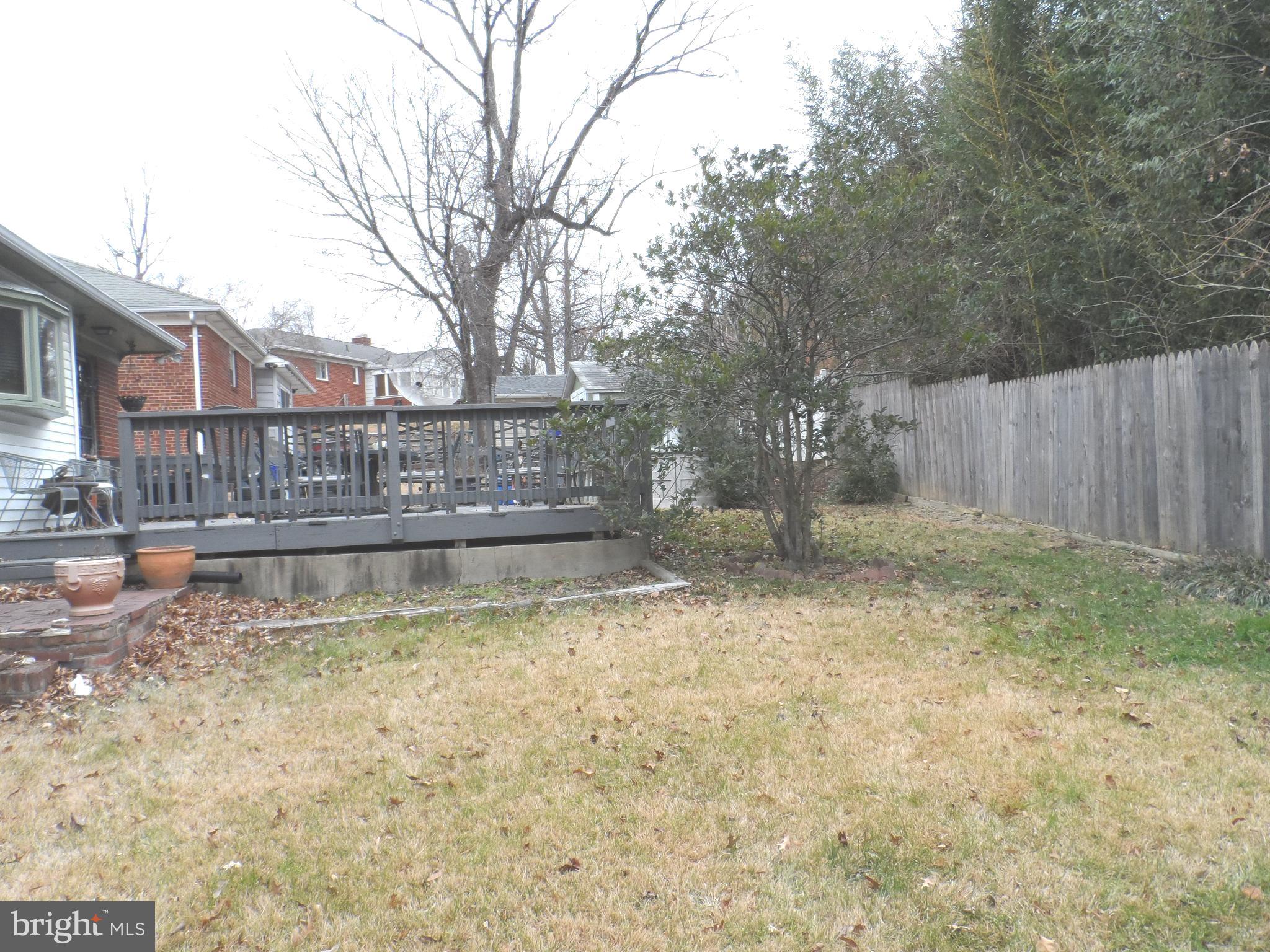 9405 Sierra Street Silver Spring, MD 20903 - Photo 18 of 19 a view of swimming pool with wooden fence