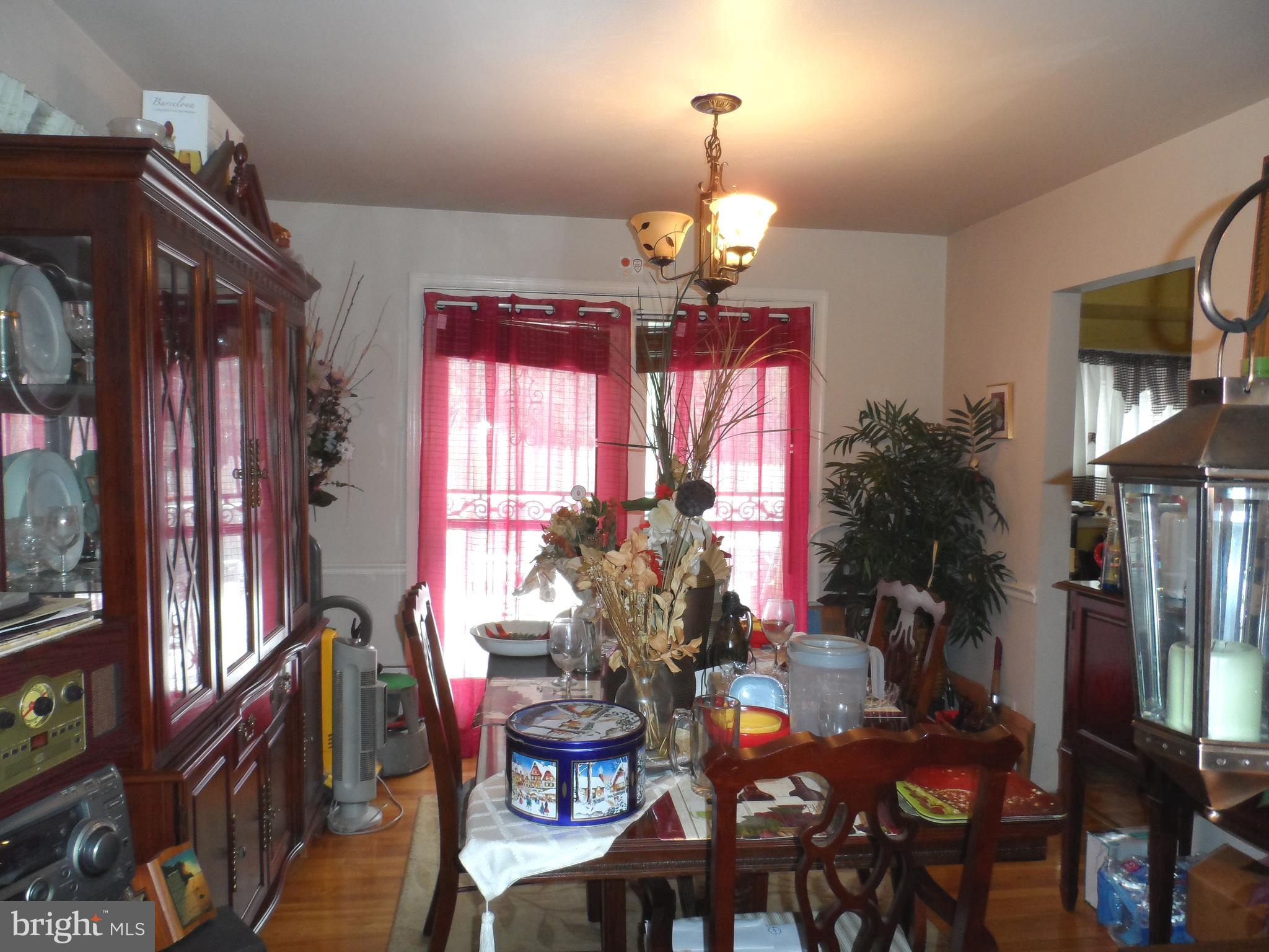 9405 Sierra Street Silver Spring, MD 20903 - Photo 3 of 19 a view of a dining room with furniture window and wooden floor