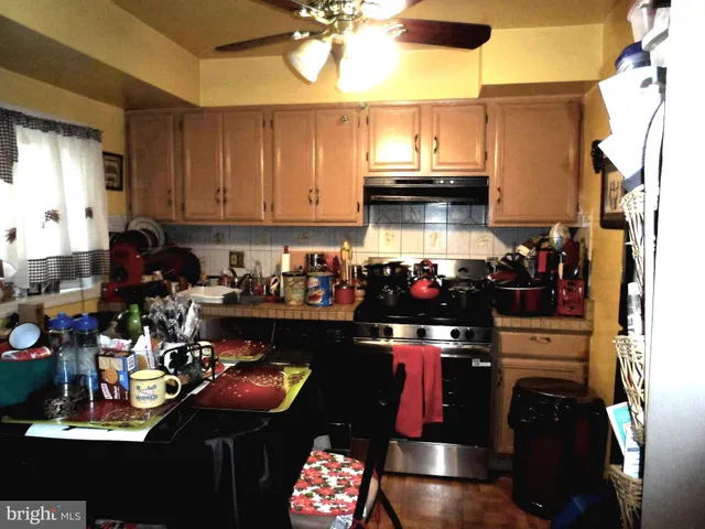 a kitchen with a stove and cabinets