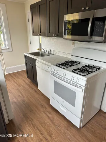 a kitchen with a stove and a microwave