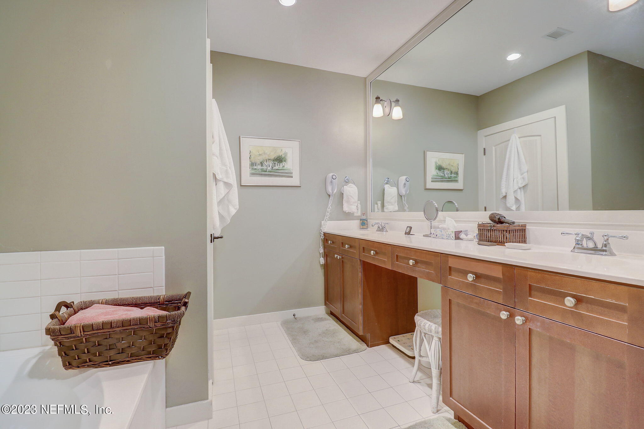 965 Registry Boulevard, Unit 307 St. Augustine, FL 32092 - Photo 11 of 31 a spacious bathroom with a double vanity sink and a mirror