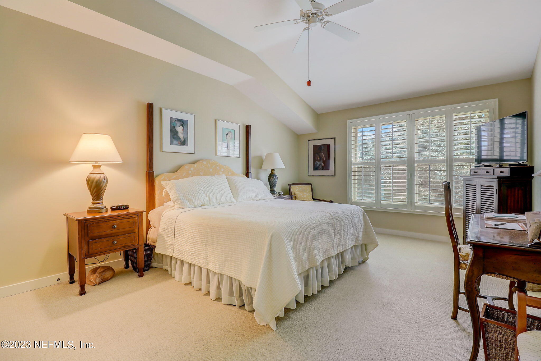 965 Registry Boulevard, Unit 307 St. Augustine, FL 32092 - Photo 13 of 31 a bed room with a bed and a chandelier