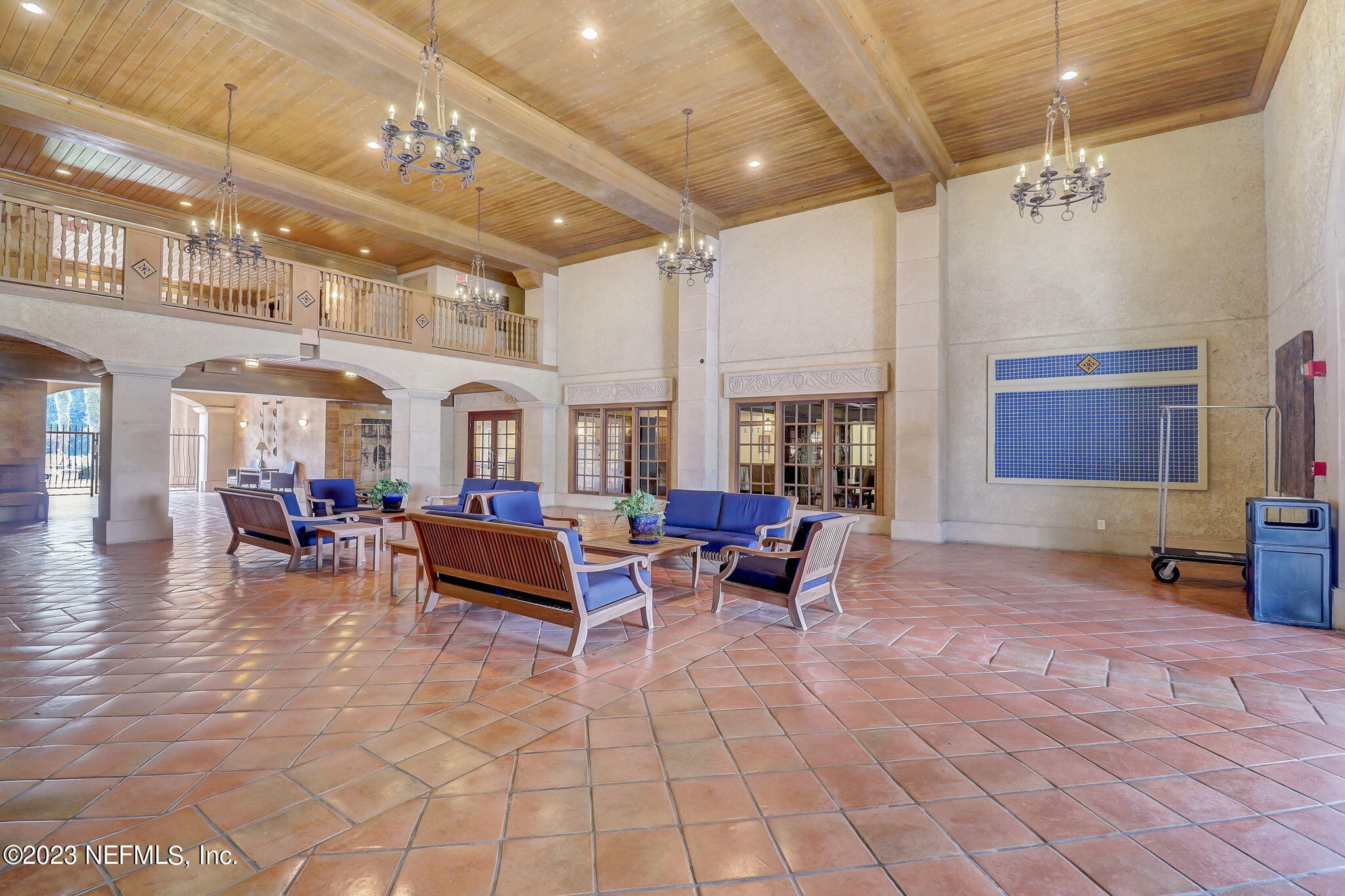 965 Registry Boulevard, Unit 307 St. Augustine, FL 32092 - Photo 22 of 31 a living room with furniture and a chandelier