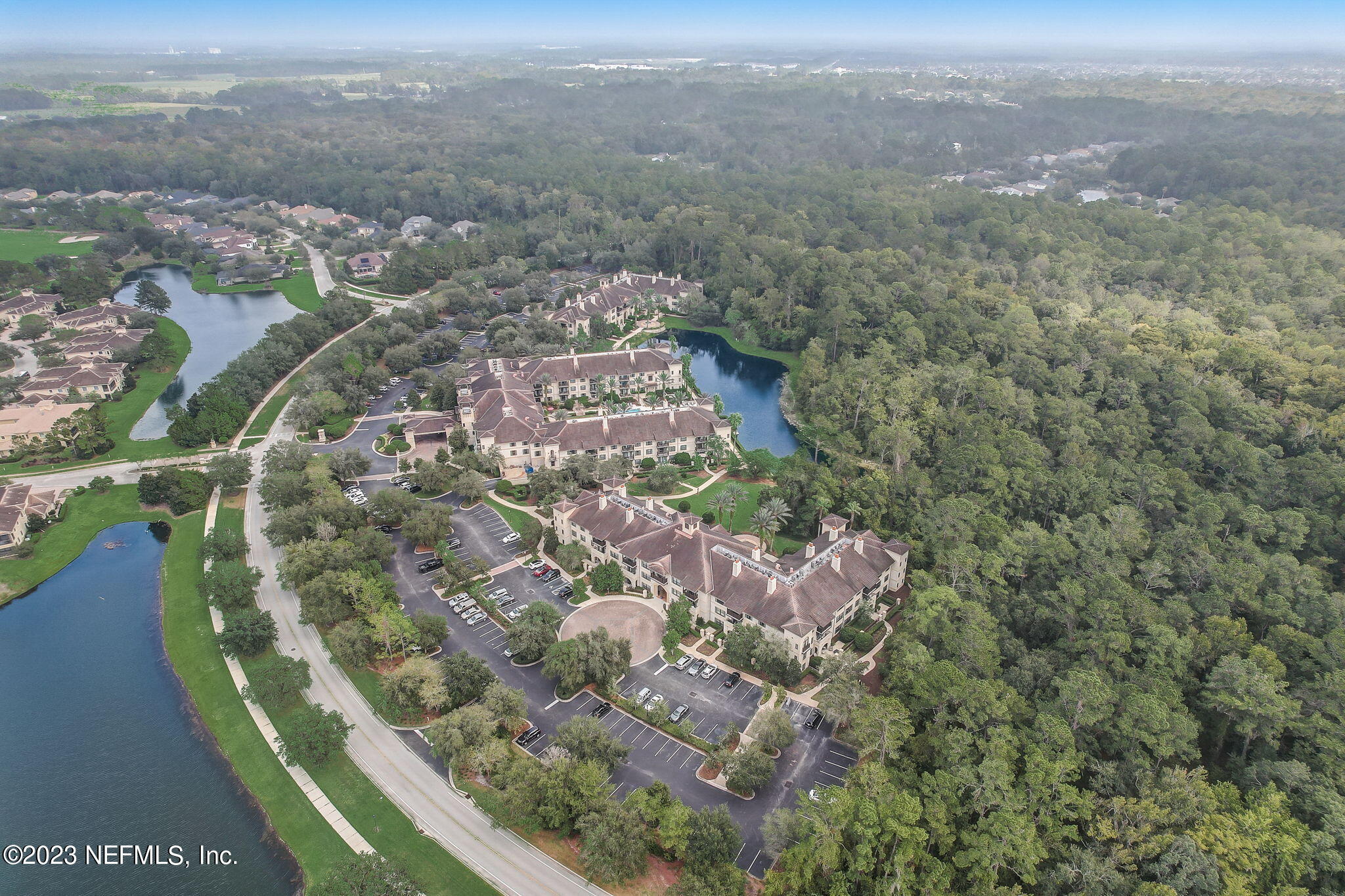 965 Registry Boulevard, Unit 307 St. Augustine, FL 32092 - Photo 30 of 31 an aerial view of residential houses with outdoor space