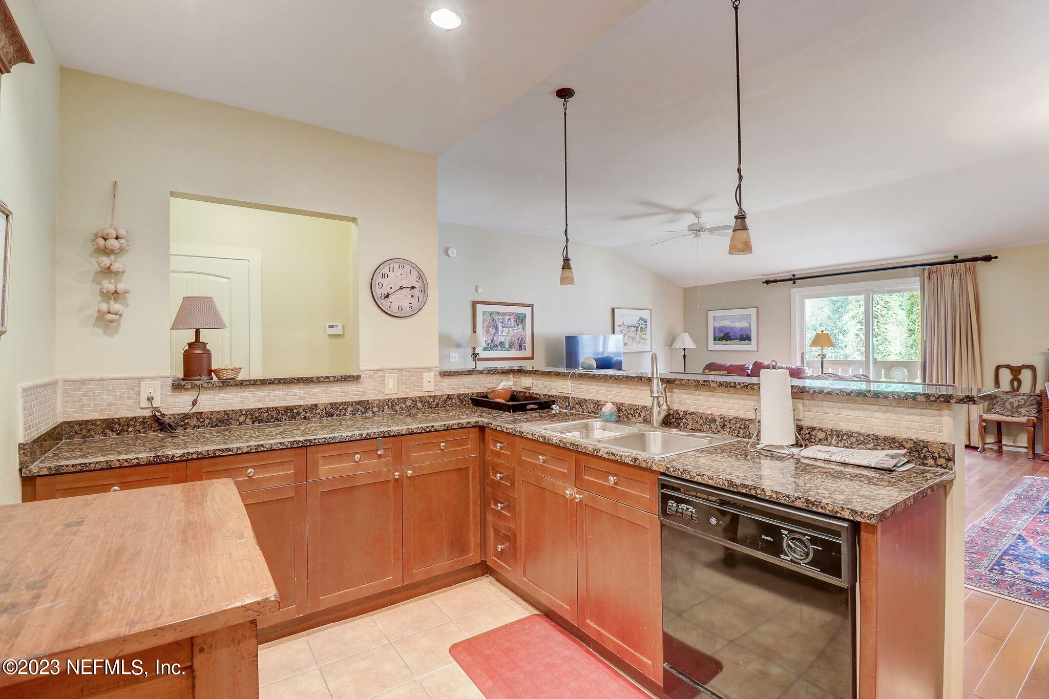 965 Registry Boulevard, Unit 307 St. Augustine, FL 32092 - Photo 6 of 31 a kitchen with stainless steel appliances granite countertop a sink a stove and a wooden floors