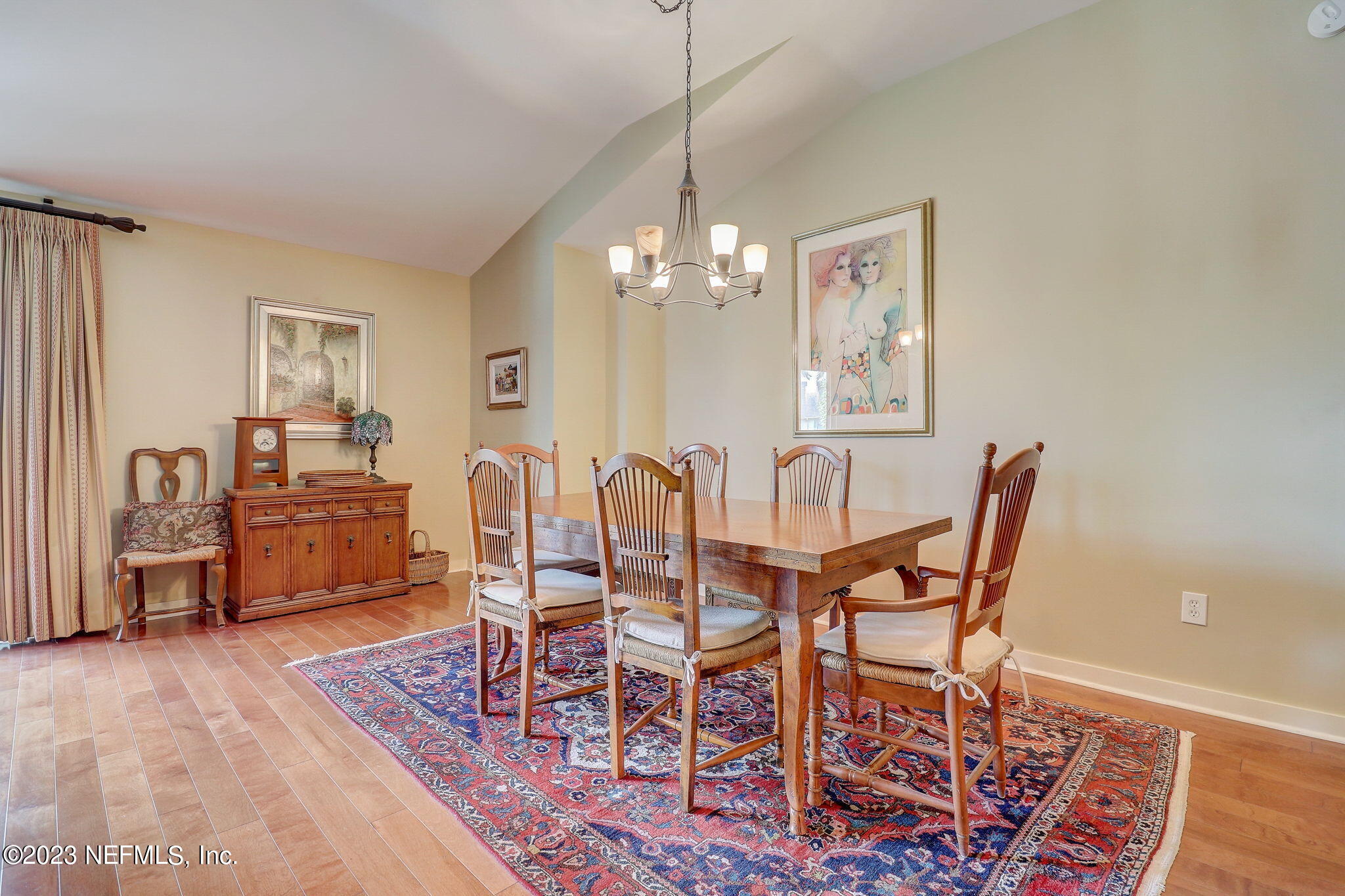 965 Registry Boulevard, Unit 307 St. Augustine, FL 32092 - Photo 8 of 31 a dining room with furniture and wooden floor