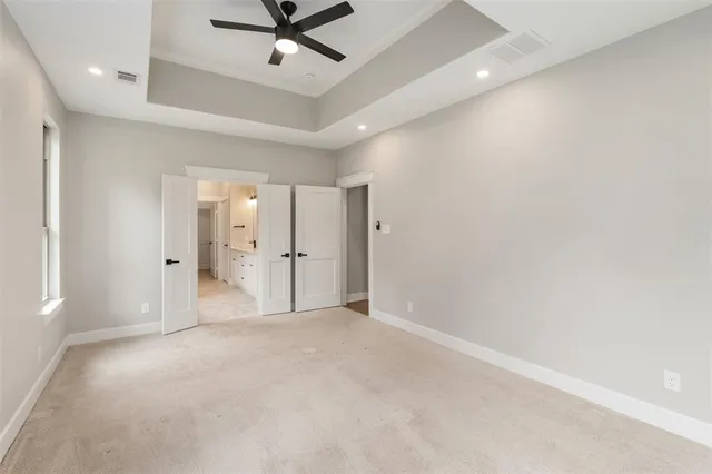 a white toilet sitting next to a white sink