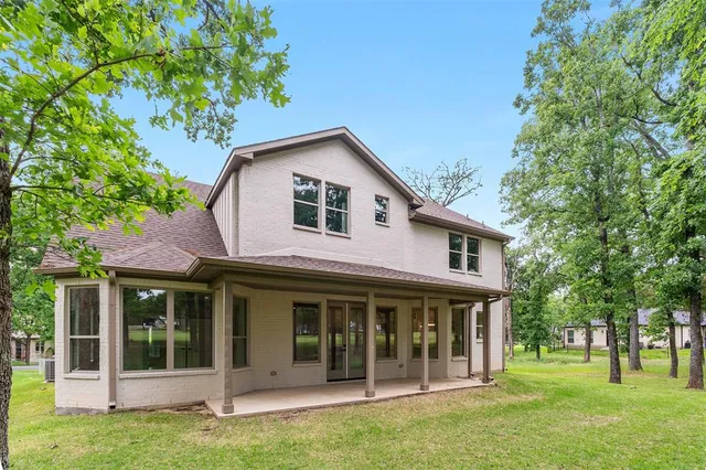 a view of a swimming pool with a lounge chairs