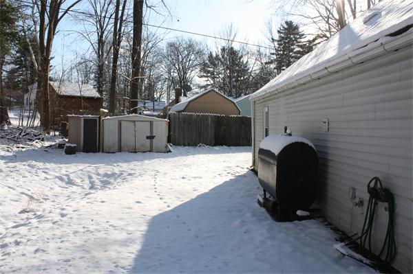37 Anzio Road Athol, MA 01331 - Photo 2 of 9 a view of a backyard with a barbeque grill and a large tree