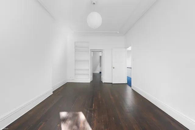 a bathroom with a toilet and a bathtub