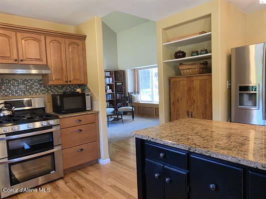 1599 Samuels Road Sandpoint, ID 83864 - Photo 16 of 56 Kitchen range and island