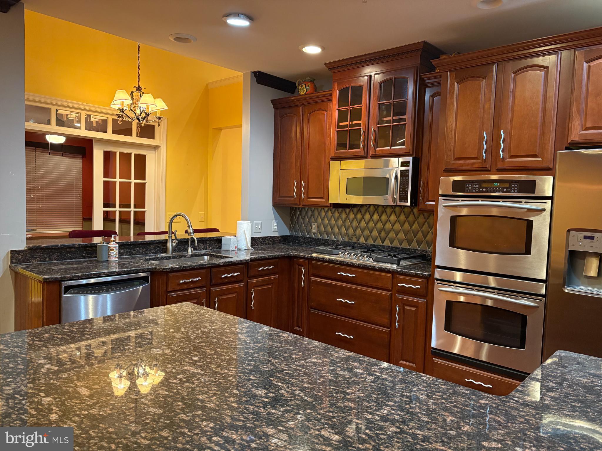 950 Nathaniel Trail Warminster, PA 18974 - Photo 18 of 66 Elegant Kitchen with rich wood cabinetry.