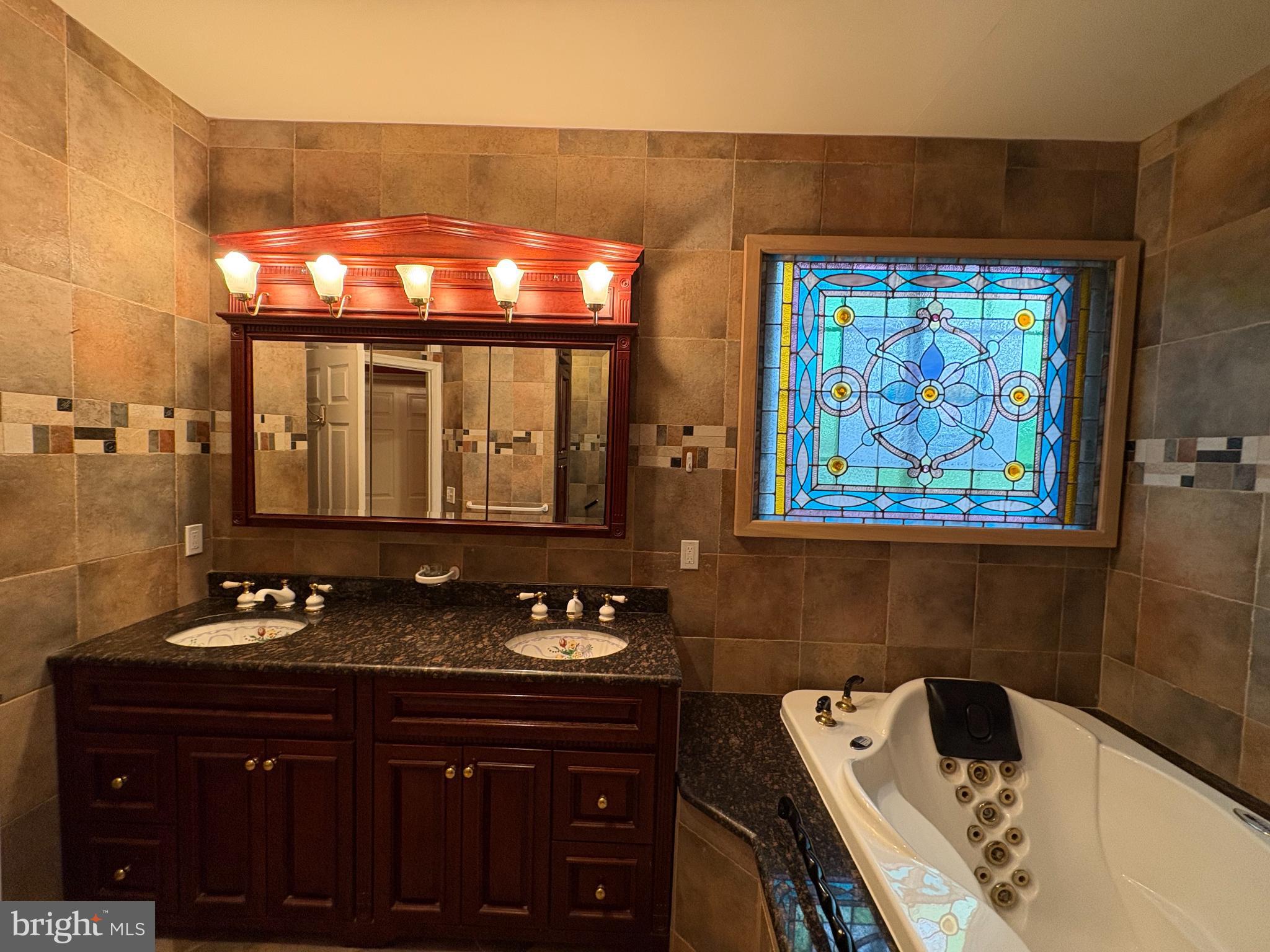 950 Nathaniel Trail Warminster, PA 18974 - Photo 26 of 66 Elegant Master Bathroom with stained glass window.