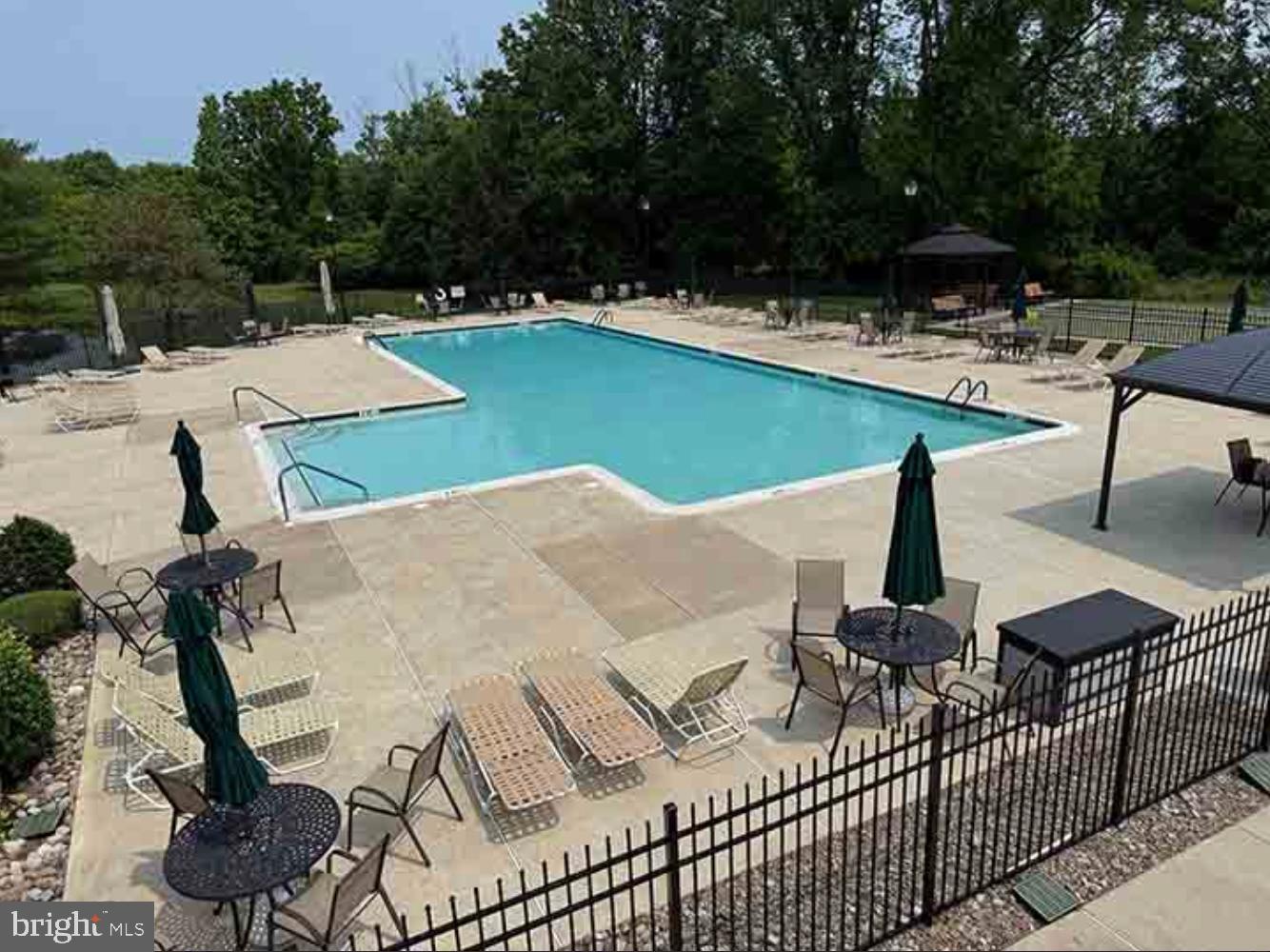 950 Nathaniel Trail Warminster, PA 18974 - Photo 6 of 66 Serene poolside retreat surrounded by nature.