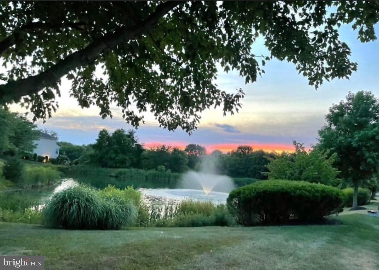 950 Nathaniel Trail Warminster, PA 18974 - Photo 64 of 66 Tranquil sunset over a serene pond.
