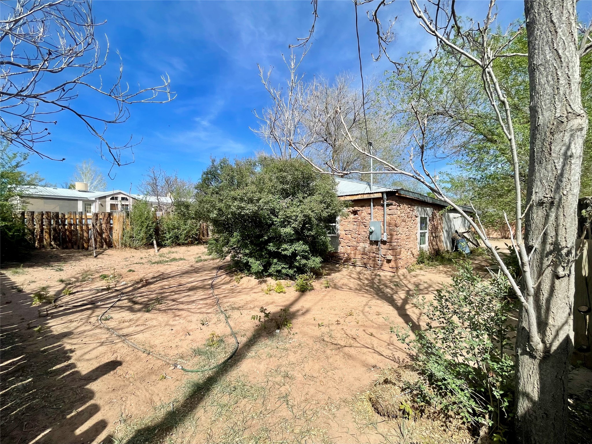 203 Highway 3 Ribera, NM 87560 - Photo 45 of 46 Rock House Back Yard
