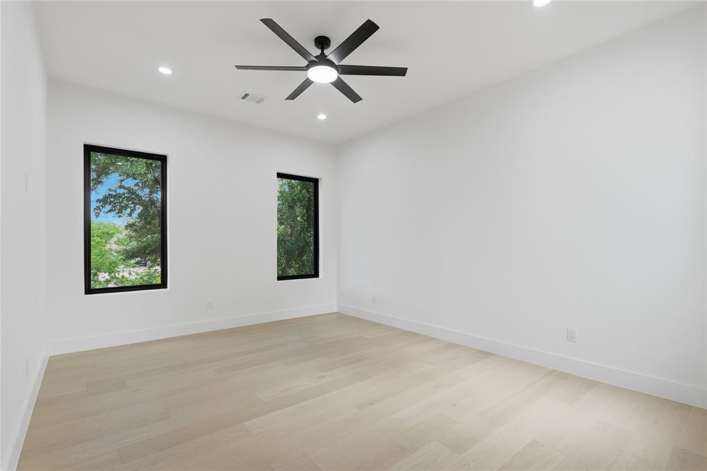 6038 Prospect Avenue Dallas, TX 75206 - Photo 36 of 40 Spacious room featuring light wood-finish flooring, recessed lighting, and a contemporary ceiling fan