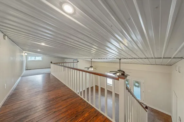 a view of a yard with wooden fence