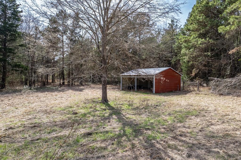 1070 Piney Grove Road Rusk, TX 75785 - Photo 26 of 39 a house view with a backyard space