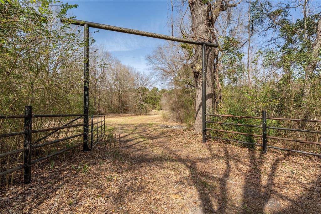 1070 Piney Grove Road Rusk, TX 75785 - Photo 27 of 39 a view of a yard with wooden fence