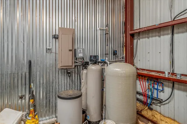a kitchen with stainless steel appliances granite countertop a sink and a refrigerator