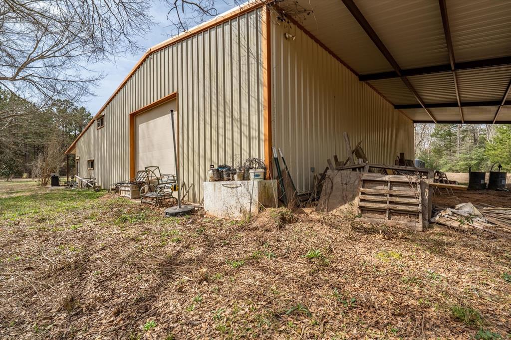 1070 Piney Grove Road Rusk, TX 75785 - Photo 8 of 39 a backyard of a house with table and chairs